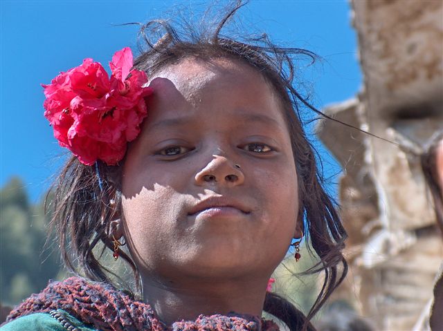 Girl with Rodondendren flower in Murma village